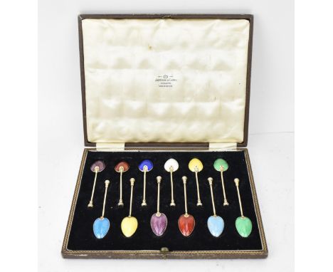 A cased set of Elizabeth II silver-gilt and enamel coffee spoons by Barker Brothers Silver Ltd, Birmingham 1952, each with co