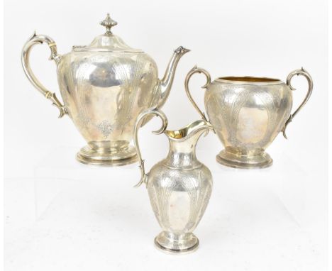 A Victorian silver three piece tea set by John, Edward, Walter & John Barnard, London 1876, comprising a teapot, twin-handled