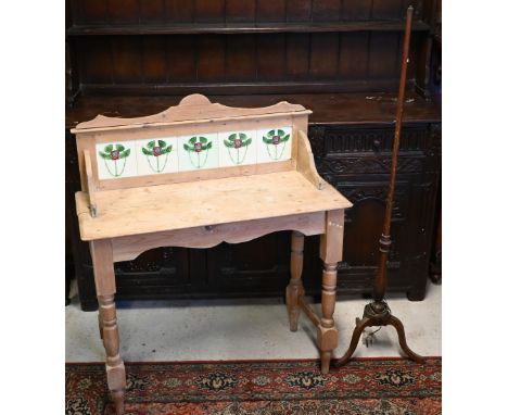 An Edwardian stripped pine wash stand with galleried back and Art Nouveau floral tiles, 92 cm wide x 40 cm deep x 106 cm high