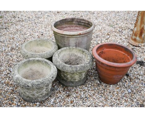 Two weathered terracotta planter pots to/with three other pots with lattice decoration (5) 
