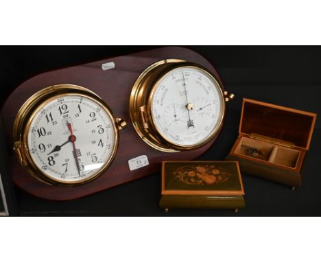 Marine clock and aneroid barometer in brass drum cases, mounted on teak plaque, 45 cm wide overall to/w two marquetry-inlaid 