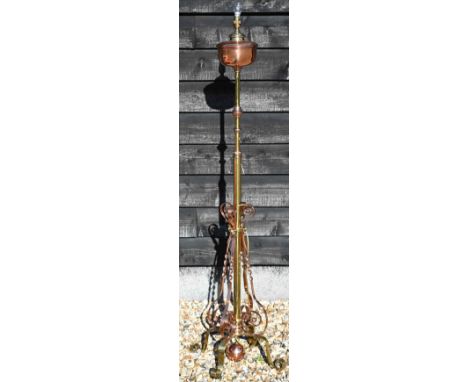 A polished copper and brass adjustable standard lamp (converted from oil) to/w pair of chased and embossed brass standard lam