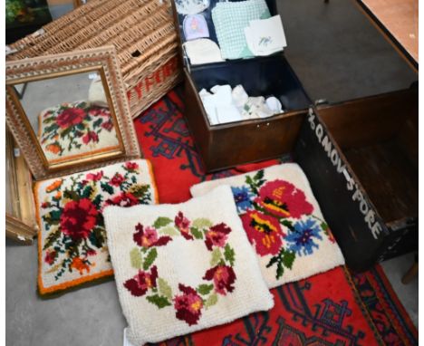 Wicker hamper, steel trunk containing linen, wall mirror with velvet-mounted frame, and three cushions and a small vintage sh