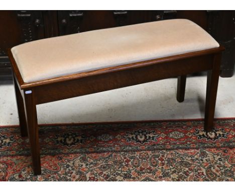 A modern oak framed fabric seat music bench with hinged seat to/w a small foot stool (2) 