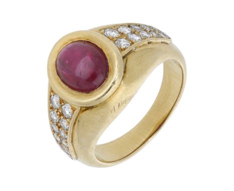 A ruby and diamond dress ring by Cartier, the ruby cabochon collet set between graduated brilliant-cut diamond shoulders, mou