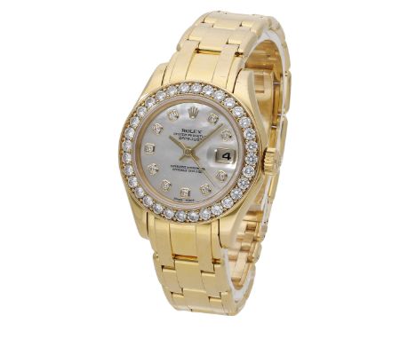 Rolex. A lady’s gold and diamond-set automatic wristwatch with date, mother-of-pearl dial and bracelet, Ref. 69298, Datejust,