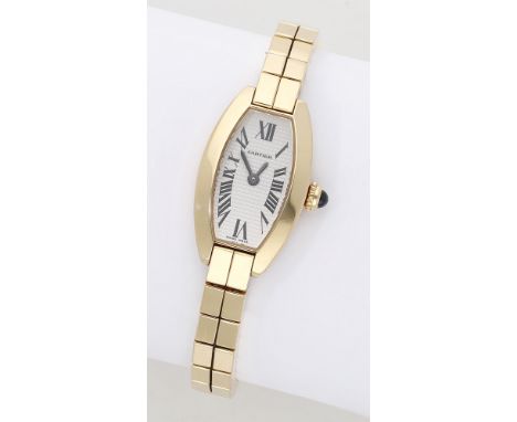 Cartier. A lady’s gold tonneau-form bracelet watch, Ref. 2563, Lanières Mini Tonneau, circa 2003. Movement: quartz. Dial: sil