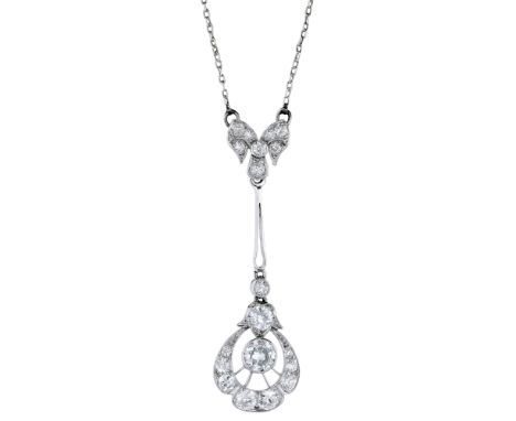 An early 20th century diamond pendant, set throughout with old brilliant-cut and single-cut diamonds, the bow surmount suspen