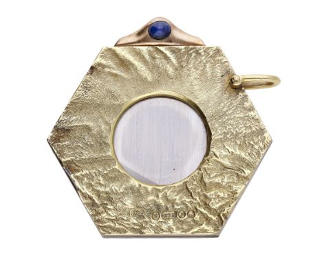 A 9ct gold and sapphire set cigar cutter by Ramsden & Roed Ltd, 1970,  the hexagonal shaped cutter with yellow gold textured 