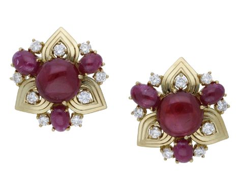 A pair of 18ct gold ruby and diamond earrings, 1990, the stylised flowerheads set with circular ruby cabochons, with pierced 