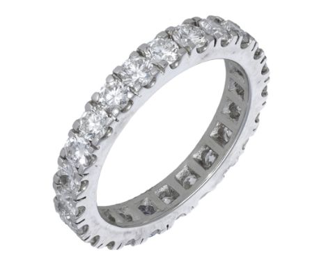 An 18ct white gold diamond eternity ring, 2010, claw-set throughout with brilliant-cut diamonds, London hallmark, maker’s mar