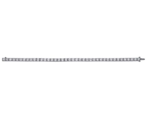 A diamond line bracelet, set with a continuous row of brilliant-cut diamonds, stamped ‘PLAT’, total diamond weight approximat