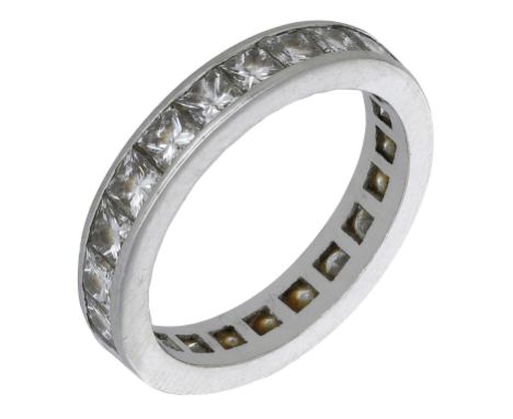 A diamond eternity ring, set throughout wit princess-cut diamonds, total diamond weight approximately 2.90 carats, ring size 
