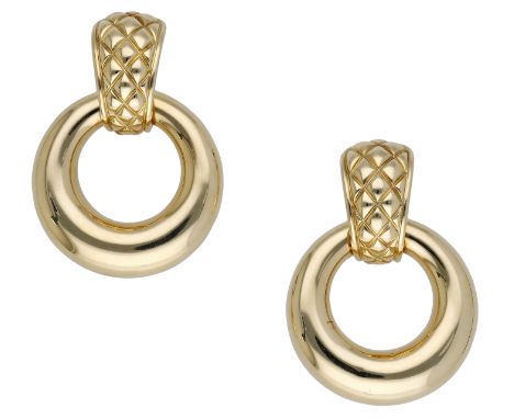 A pair of hoop ear clips by Chaumet, the domed hoops suspended beneath tapered surmounts with crosshatched decoration, signed