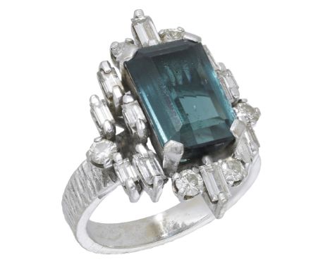 A tourmaline and diamond ring, attributed to Alan Gard, circa 1970, the rectangular step-cut tourmaline set within a lozenge-