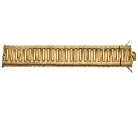 A mid 20th century strap bracelet, of odeonesque design, the reeded centre between a scalloped border, with matte and satin f