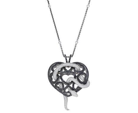 A diamond chain and pendant by Theo Fennell, the brilliant-cut diamond serpent with ruby eyes and coiled through an openwork 