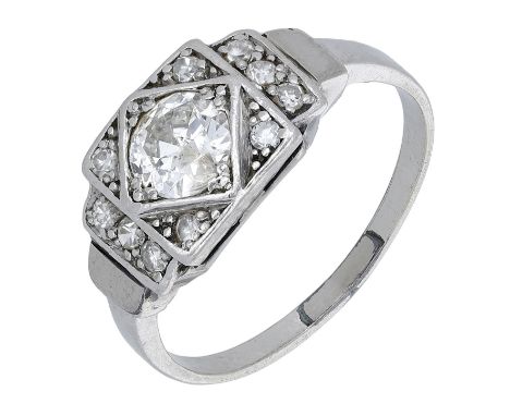 An Art Deco diamond ring, the central transitional-cut diamond within a stepped surround of single-cut diamonds, mounted in p