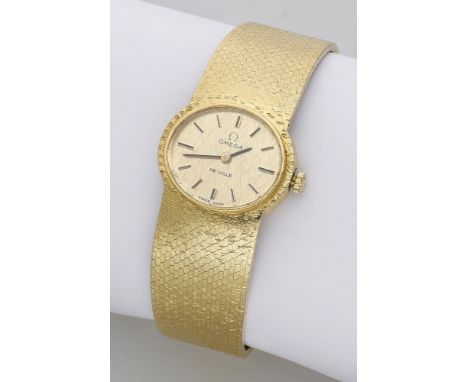 Omega. A lady’s gold oval bracelet watch, Ref. 8228, De Ville, circa 1972. Movement: manual winding, no. 35947146. Dial: gilt