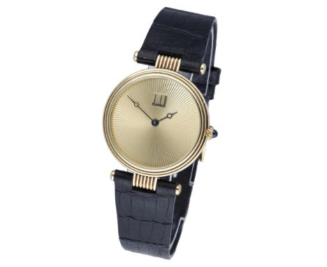 Dunhill.  A gold wristwatch, Ref. 8323, circa 1990. Movement: quartz. Dial: gilt sunburst design. Case: 18ct gold, back with 