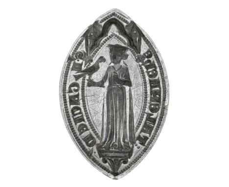 An early 14th century silver seal matrix, finely carved to depict a Lady standing on a plinth beneath a gothic canopy, facing