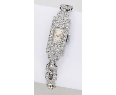 Swiss. A lady’s platinum and diamond-set Art Deco cocktail watch, circa 1930. Movement: manual winding, 17 jewels. Dial: silv