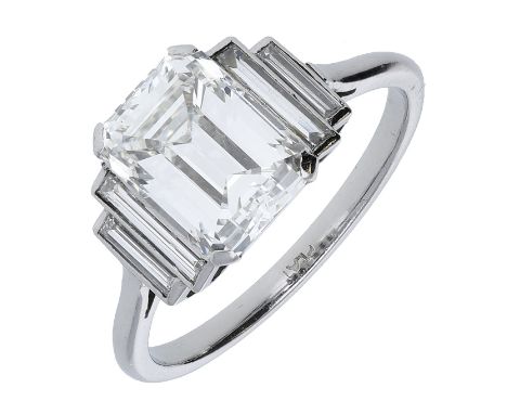 An Art Deco diamond ring, the octagonal-cut diamond weighing 3.27 carats, claw set between baguette-cut diamond shoulders, mo