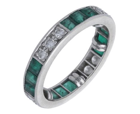 An emerald and diamond eternity ring, set throughout with alternating trios of brilliant-cut diamonds and square-cut emeralds