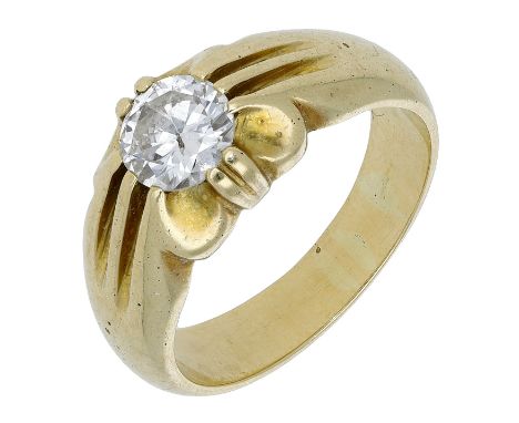 An 18ct gold single stone diamond ring, the old-cut diamond inset within claw mount, between reeded shoulders, maker’s mark t