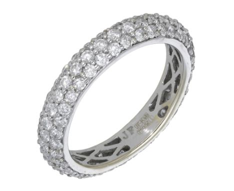 An 18ct white gold diamond band ring, 2010, pavé-set throughout with brilliant-cut diamonds, London hallmark, maker’s mark ‘J