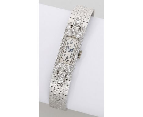 Swiss, retailed by Benson. A lady’s platinum and diamond-set cocktail watch with later added white gold bracelet, circa 1930.