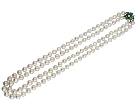 A two row cultured pearl necklace with gem-set clasp, 1986, the slightly graduated rows of cultured pearls to an 18ct gold cl