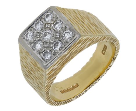 An 18ct gold diamond set panel ring, 1975, the square panel set with a series of brilliant-cut diamonds, to a tapered angular