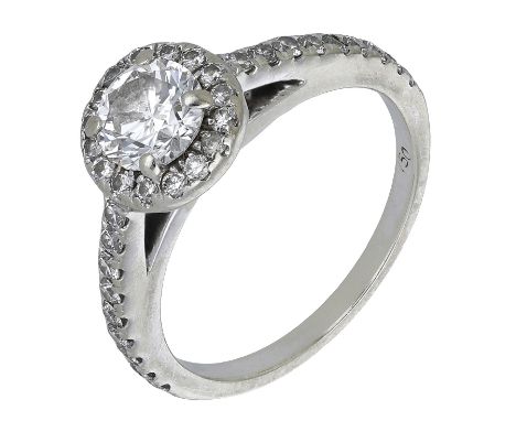 A diamond cluster ring, the central brilliant-cut diamond, weighing 0.70 carat, within a surround of similarly-cut diamonds, 