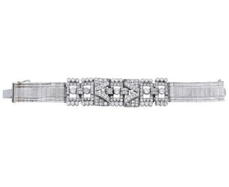 A diamond bracelet, the central Art Deco panels of pierced geometric design set throughout with old brilliant-cut and single-