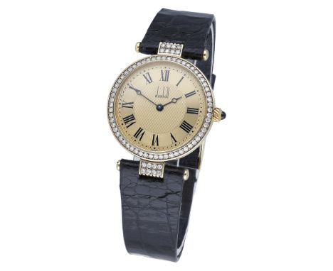 Dunhill. A gold and diamond-set wristwatch, Ref. 11470, circa 1990. Movement: quartz. Dial: gilt engine-turned, stain-finishe