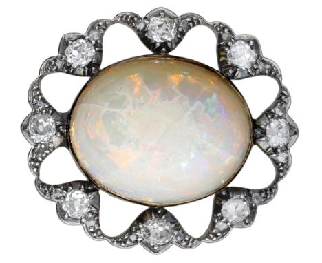 An opal and diamond brooch, circa 1890, the oval opal cabochon within an openwork surround of scalloped design and set with o