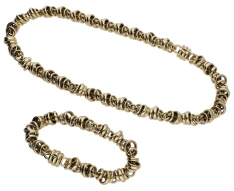 A necklace and bracelet suite by Pomellato, the fancy-link chain formed of polished roundels, the bracelet en suite, both sig