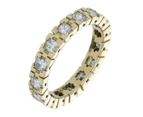 An 18ct yellow gold diamond eternity ring, 2010, set throughout with princess-cut diamonds, London hallmark, total diamond we