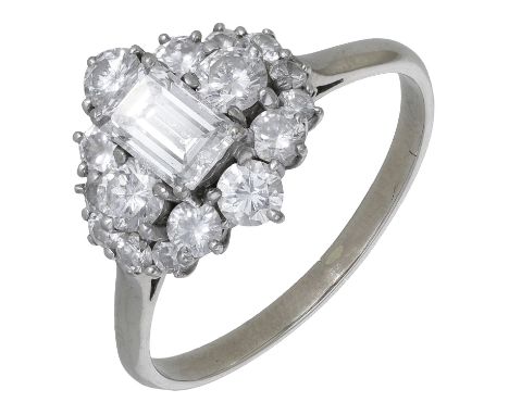 A diamond cluster ring, circa 1970, the lozenge-shaped cluster set with a principal step-cut diamond within a surround of bri