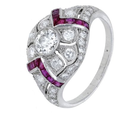 An Art Deco diamond dress ring, the bombé ring set with a central old brilliant-cut diamond, within a tapering and pierced su
