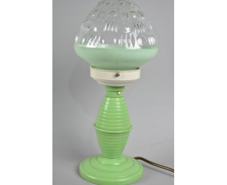 A Vintage Green Celluloid Table Lamp with Glass Shade, 34cms High 