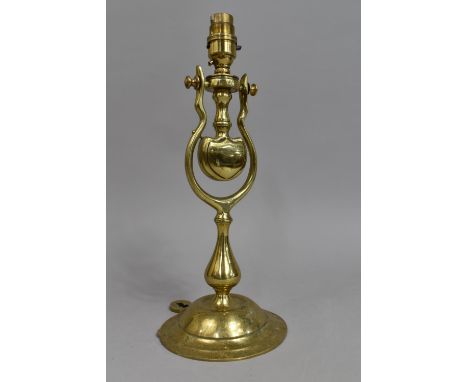 A Free Standing/Wall Hanging Brass Gimballed Light Fitting on Circular Stepped Base, 34cms High