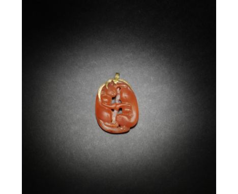 AN AGATE 'DOUBLE-BADGER' PENDANT18th/19th centuryCrisply carved in openwork as a pair of badgers, arranged head to tail, the 