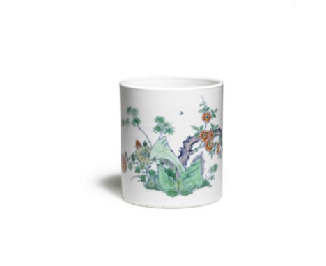 A DOUCAI BRUSHPOT, BITONGKangxiDelicately outlined in blue and enamelled with green rocks issuing a twisting grisaille branch