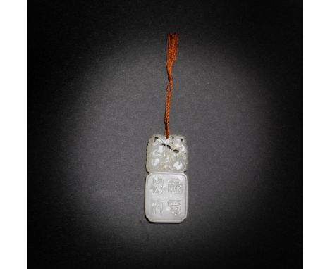 A WHITE JADE 'DOUBLE BATS' PENDANT19th centuryOf rectangular form carved as a craggy rock, one side with four-character inscr