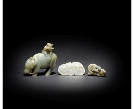 THREE SMALL JADE CARVINGS18th/19th centuryComprising a white jade pebble carved with a bat amongst stylised clouds, 6cm (2 3/