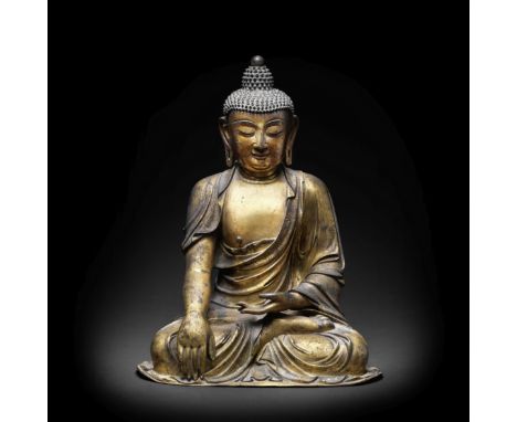 A VERY RARE LARGE GILT BRONZE FIGURE OF BUDDHA SHAKYAMUNIMing DynastySeated with crossed legs in vajraparyankasana, the right