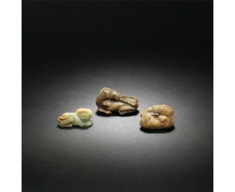 TWO JADE CARVINGS OF HORSES AND A JADE CARVING OF A BUDDHIST LIONMing DynastyThe Buddhist lion carved recumbent with its head
