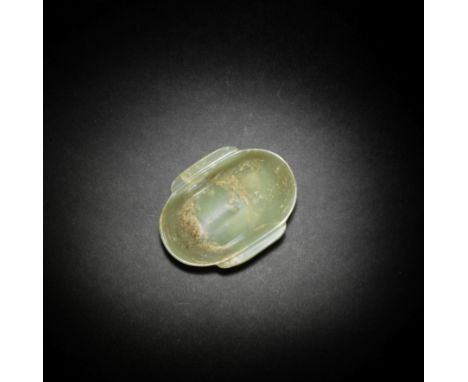 A PALE GREEN JADE 'EAR' CUPHan DynastyThe gently curved cup raised on a flat short foot with a pair of elongated 'ear' handle